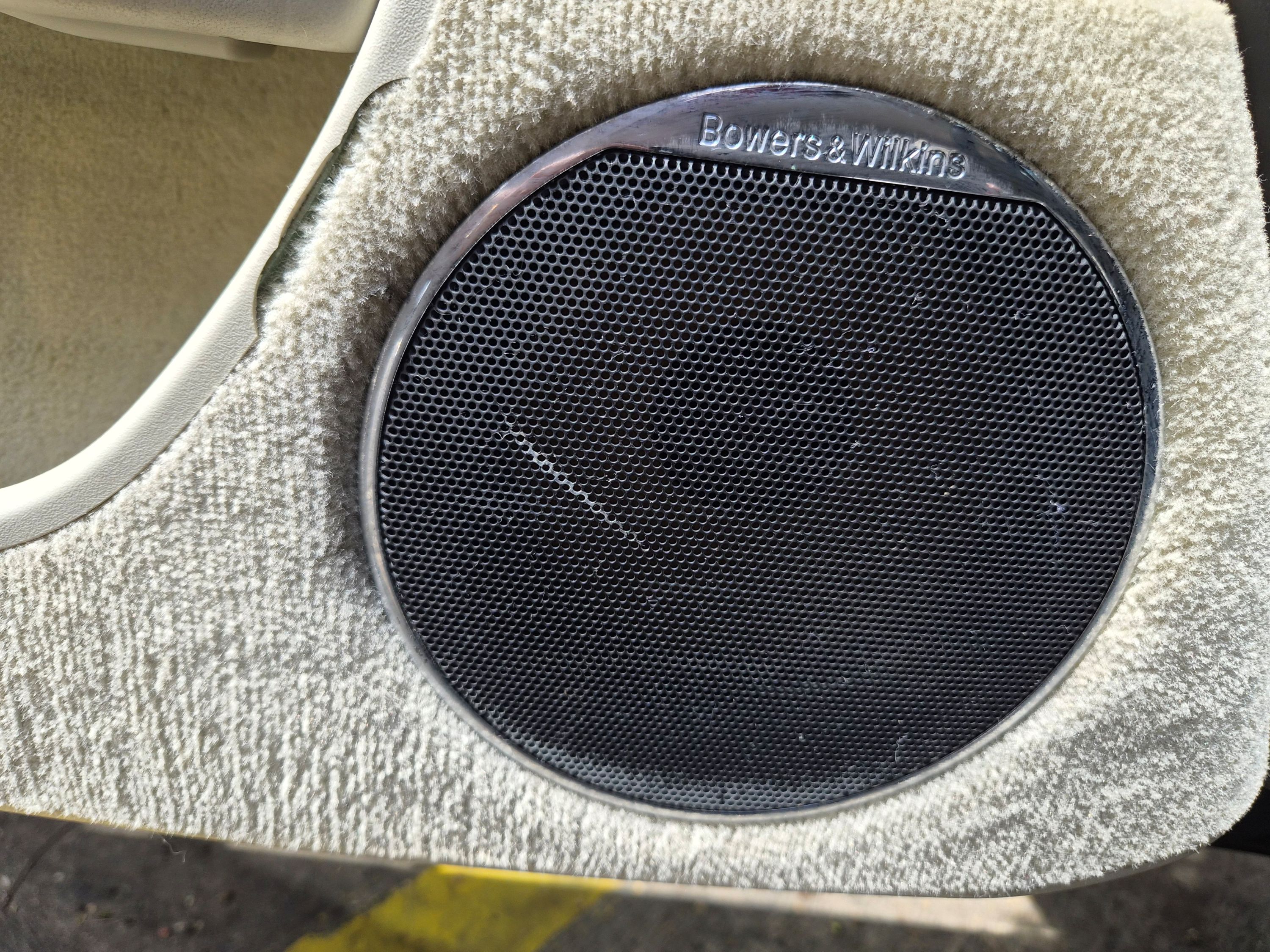 Bowers & Wilkins door speaker with minor scratch on the grille.