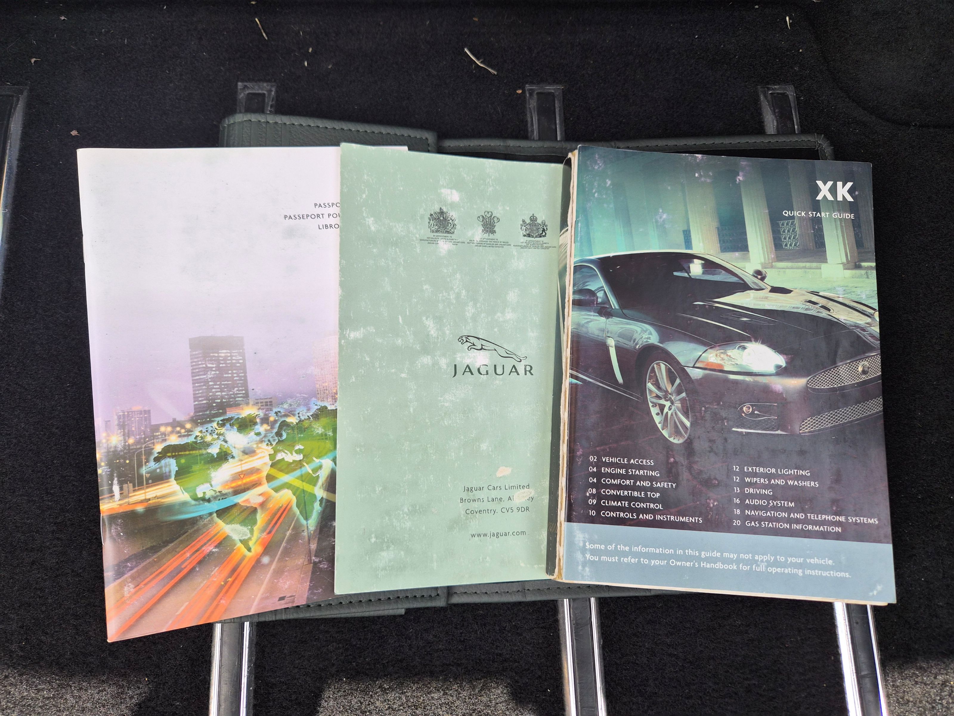 Jaguar XK owner's manual, passport service book, and quick start guide