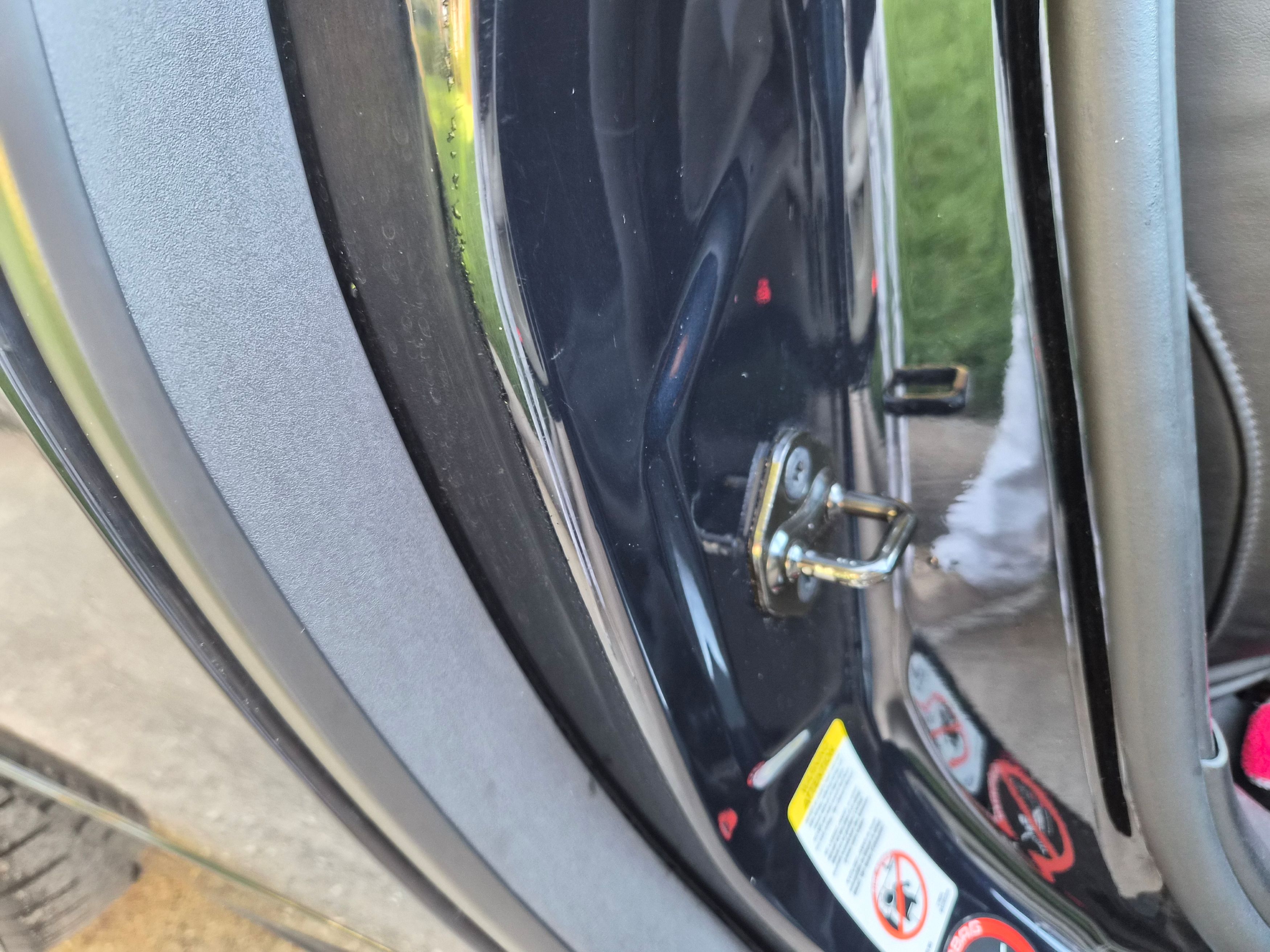 Close-up of the door jamb and striker bolt area
