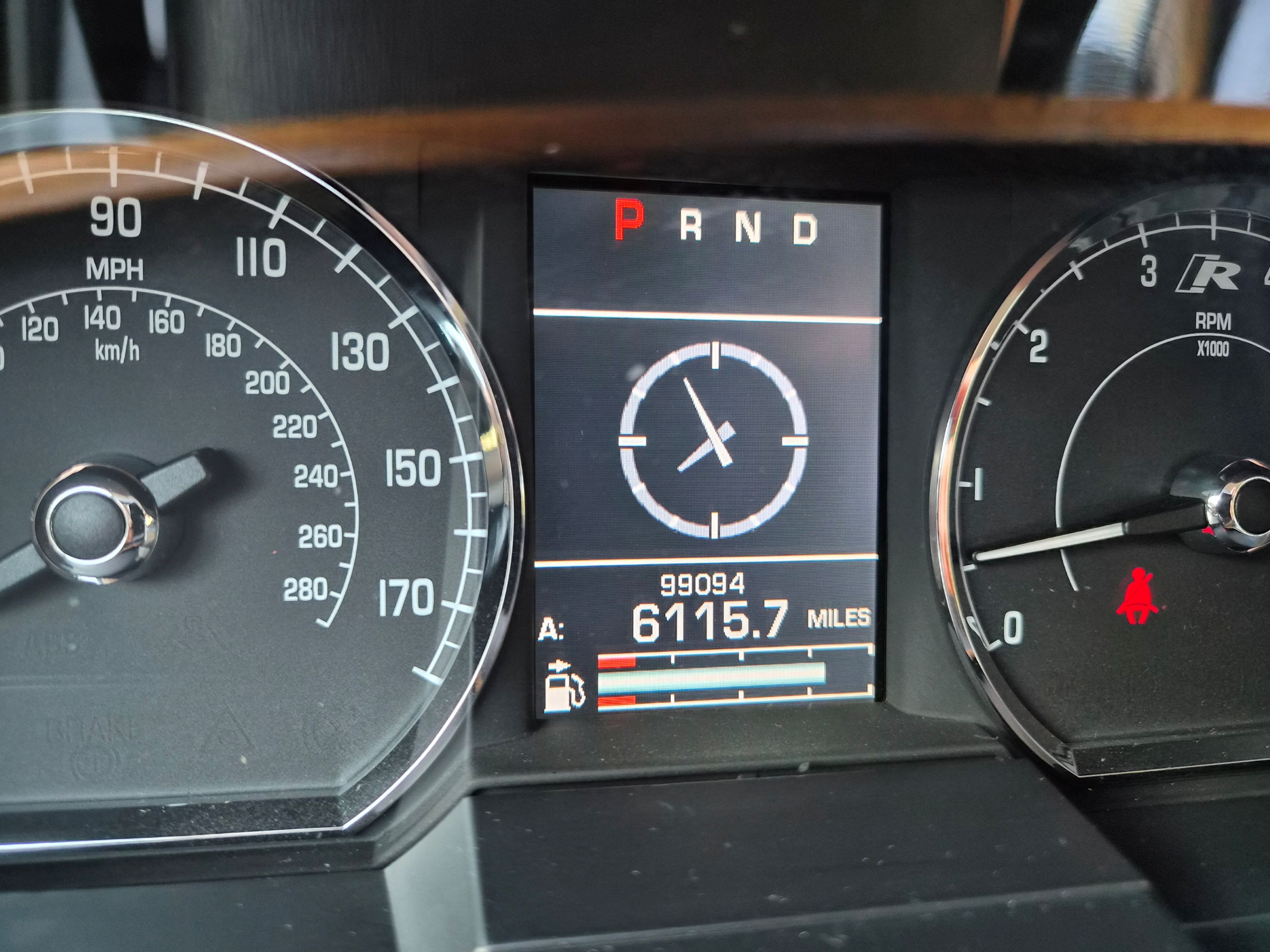 Instrument cluster showing speedometer, tachometer, and digital odometer readout