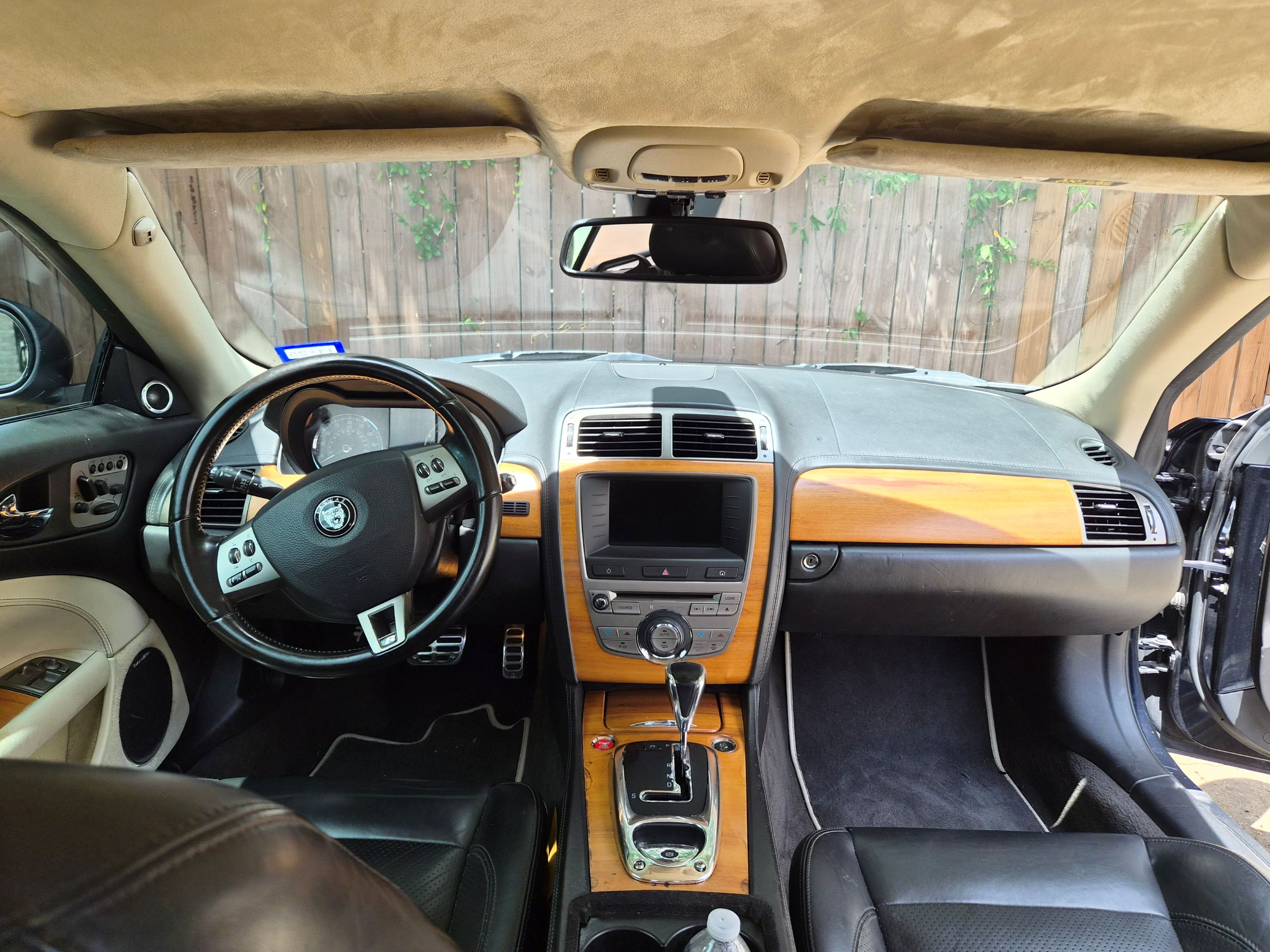 View of the front cabin featuring a wood-trimmed dashboard and steering wheel.