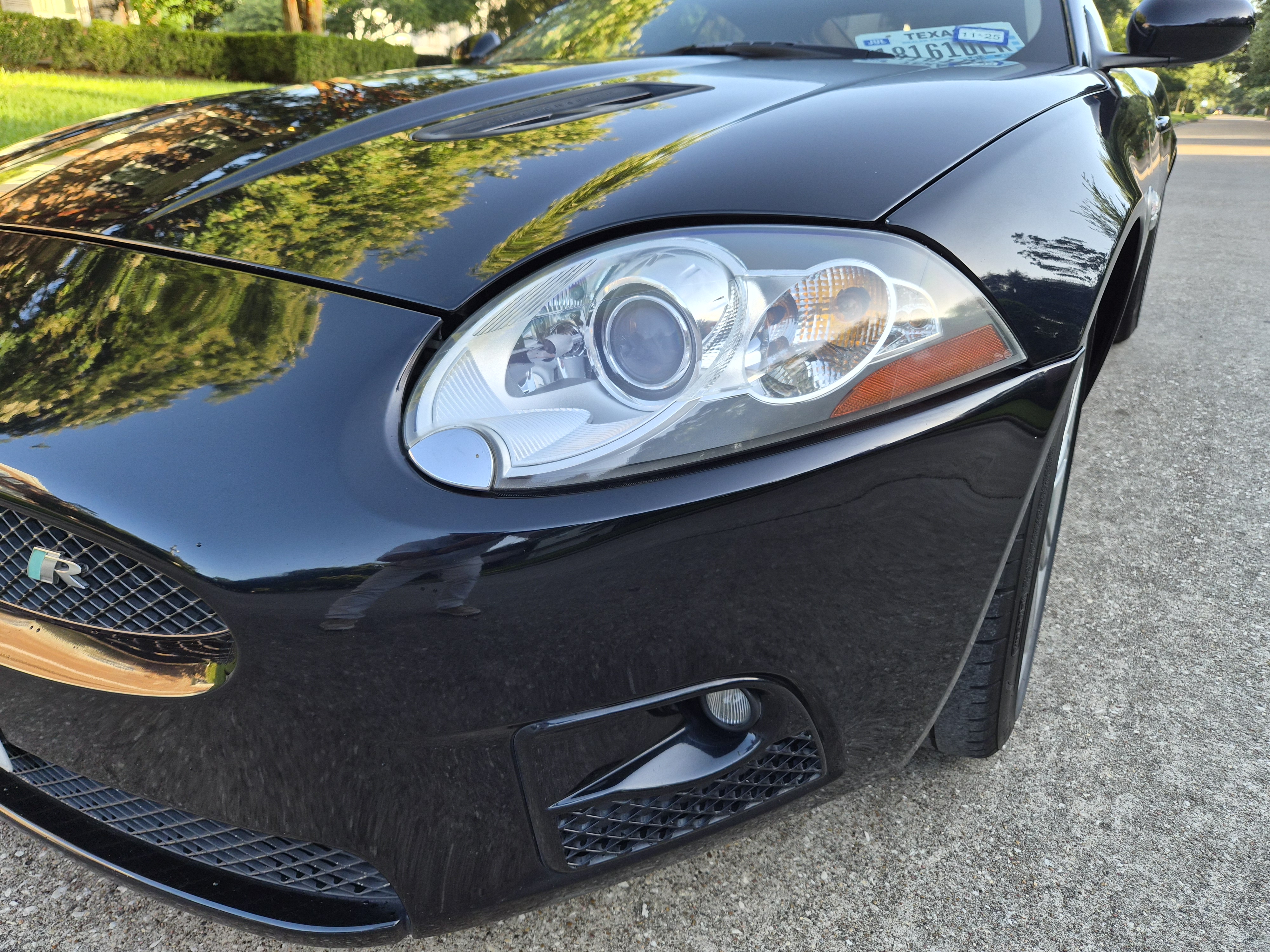 Front three-quarter view showing headlight, hood, and grille detail