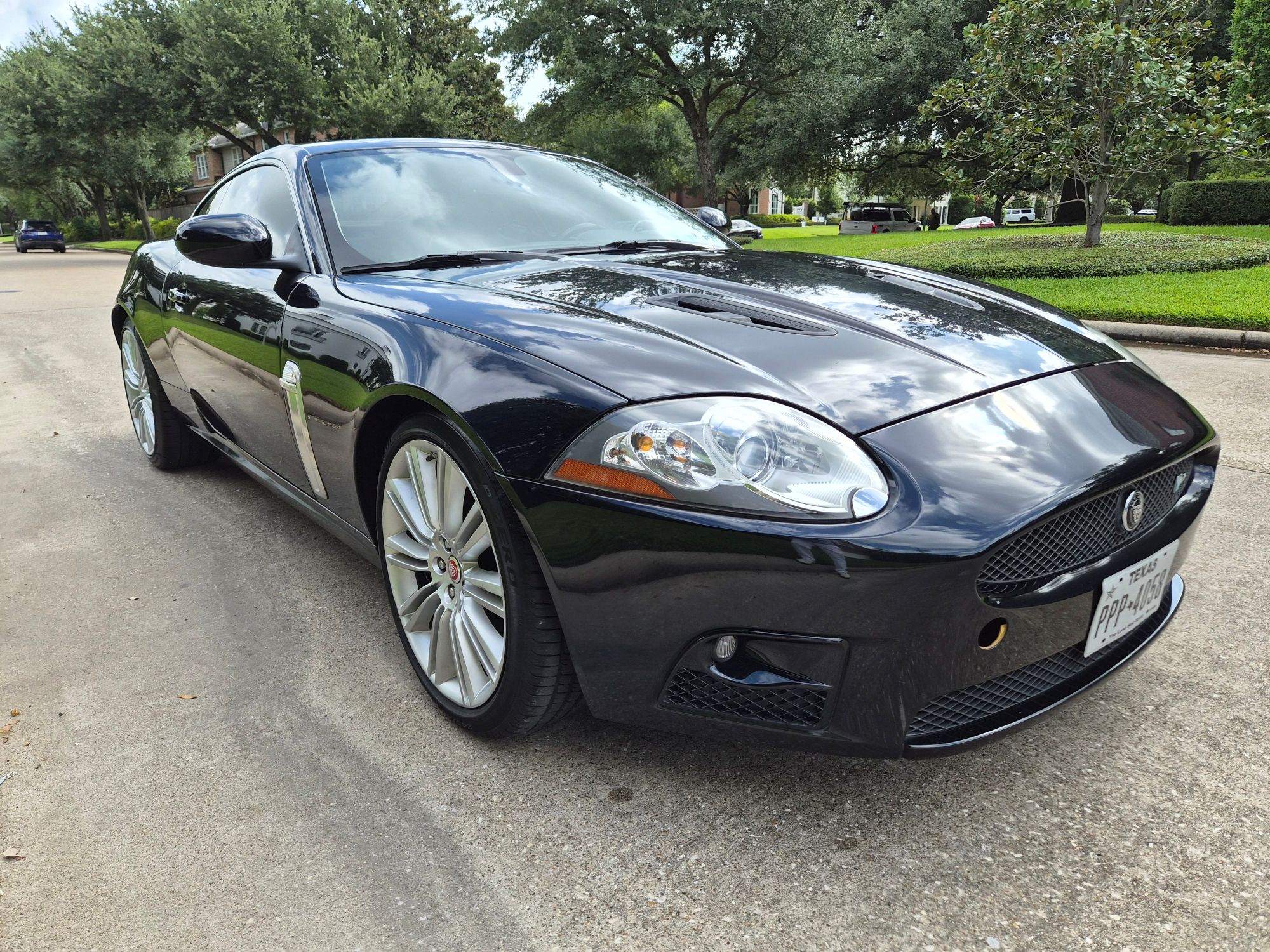 Front three-quarter view of a black Jaguar XK