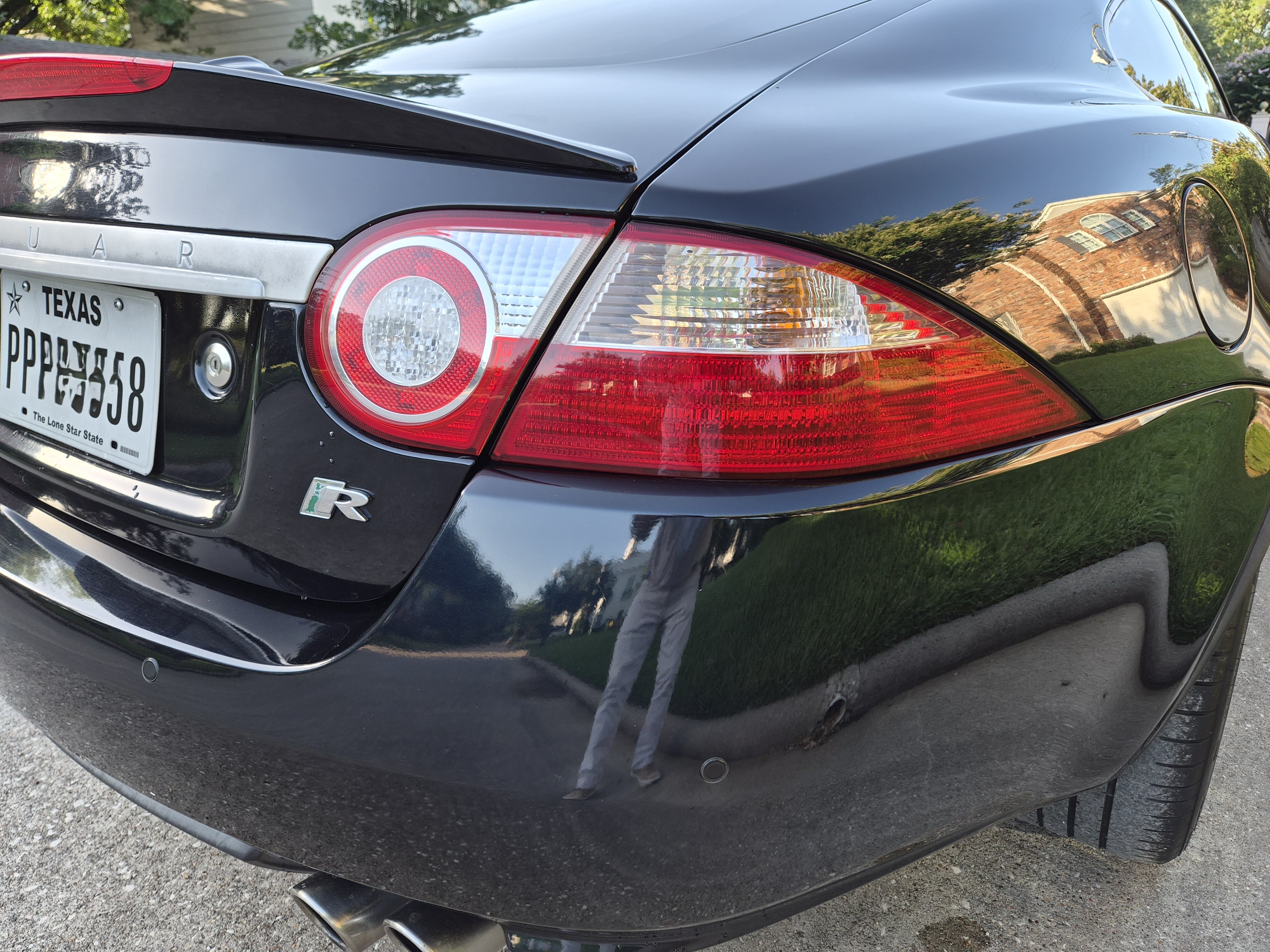 Rear passenger side quarter panel showing taillight and R badging