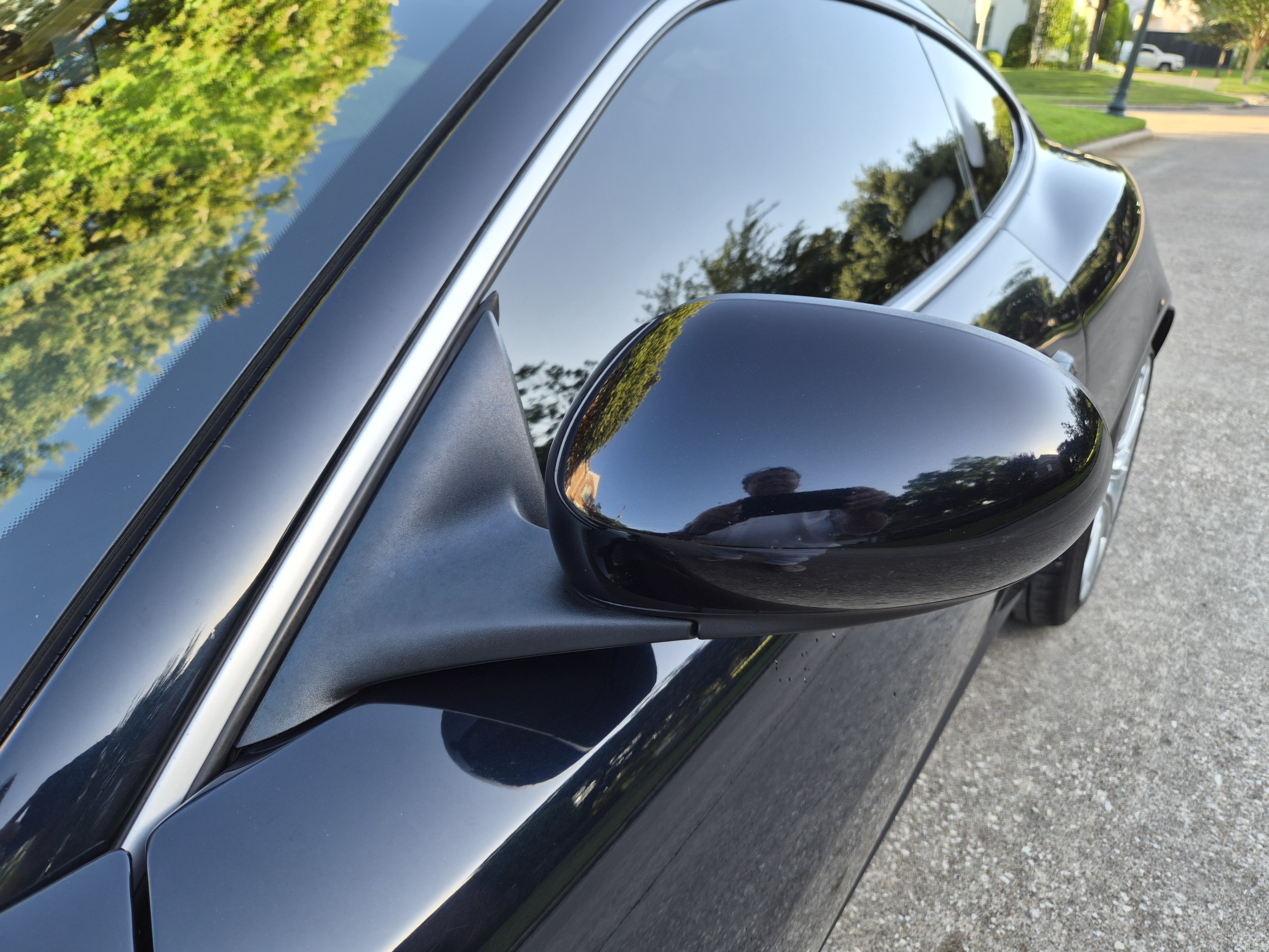 Close-up of the driver-side wing mirror and window trim.