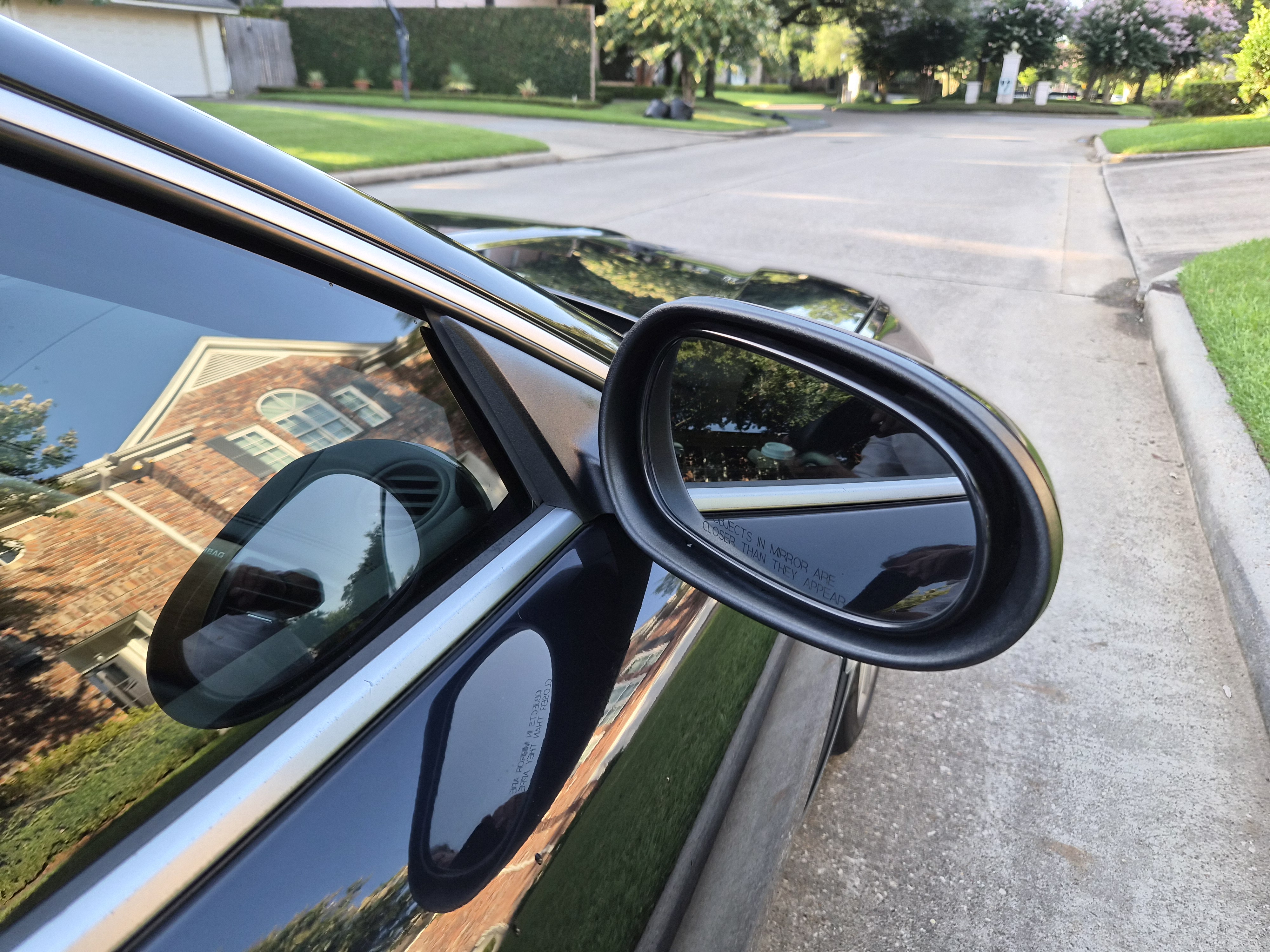 Passenger side view mirror and window trim detail