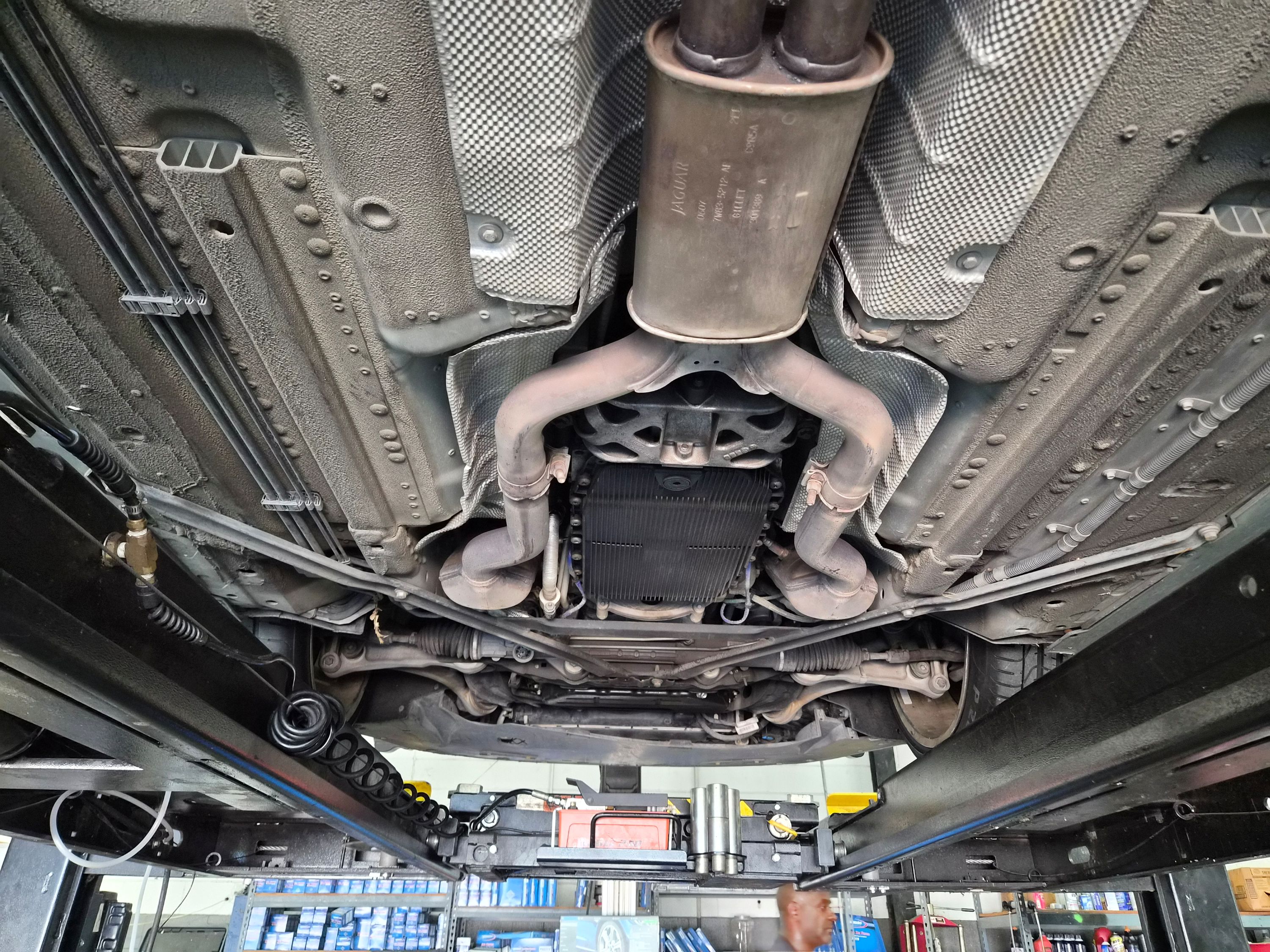 Undercarriage view of chassis, exhaust system, and transmission oil pan