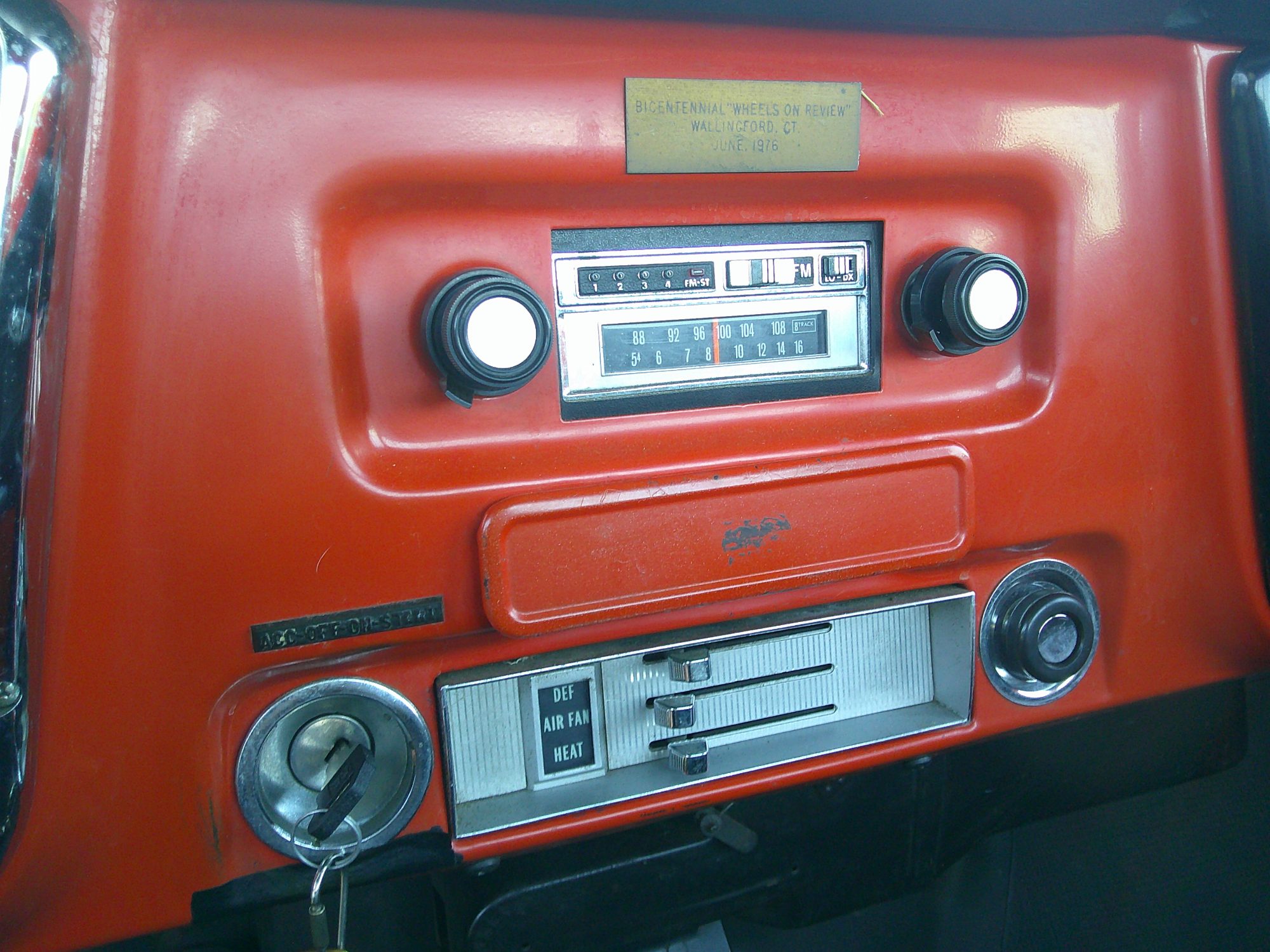 Dashboard detail featuring the radio, climate controls, and ignition switch.