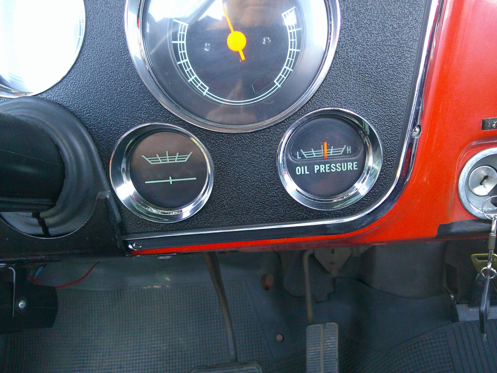 Close-up of the instrument cluster showing the oil pressure and battery gauges.